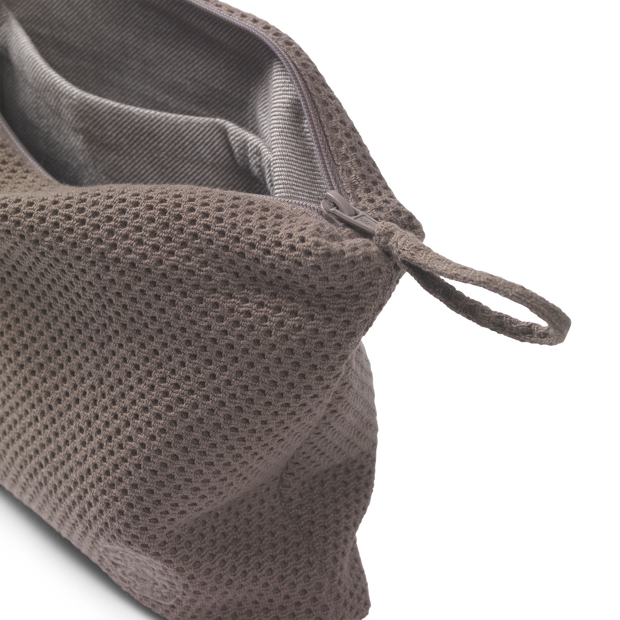 The toiletry bag from Jensen Damask is essential and