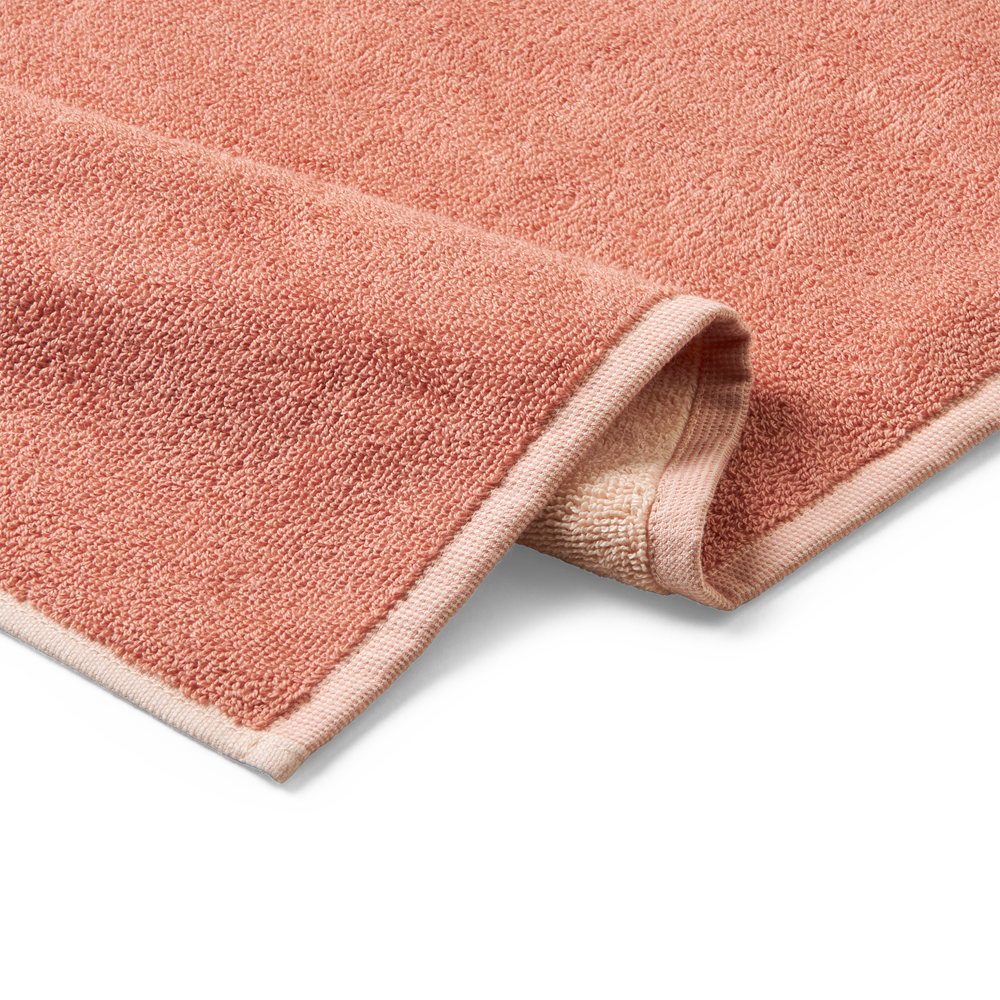 Bath towel with a X